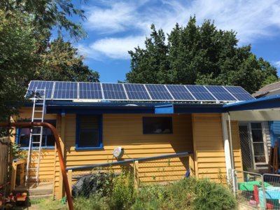Solar Panels on Woodend Playgroup using MicroInverters and Shade-Resistent Solar Panels